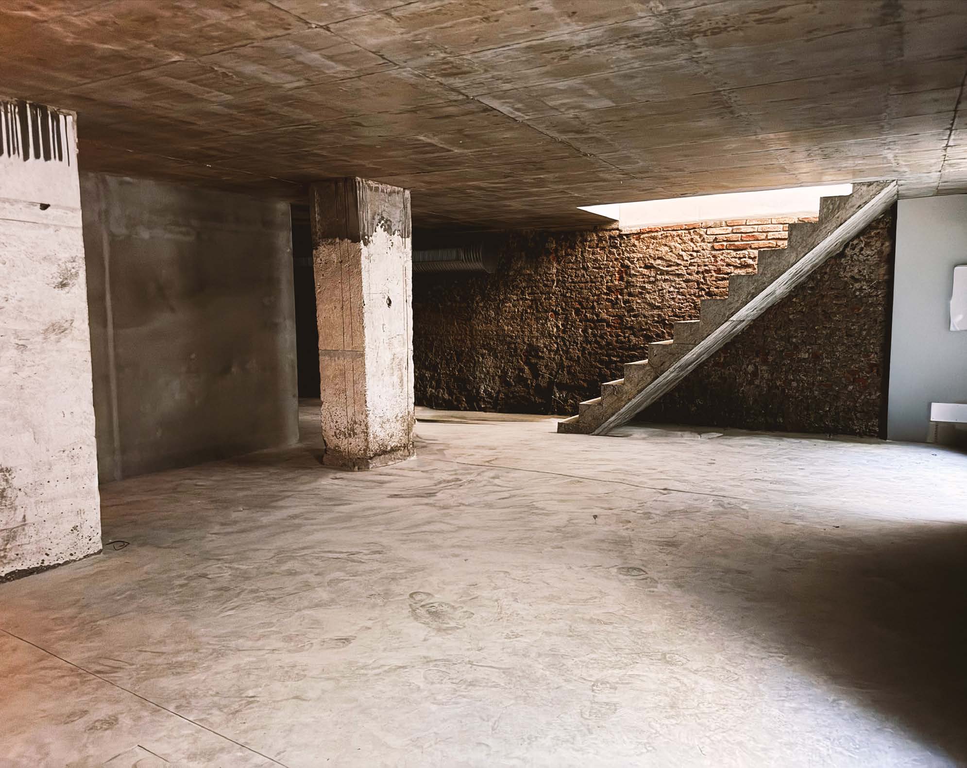 Lower level — raw concrete